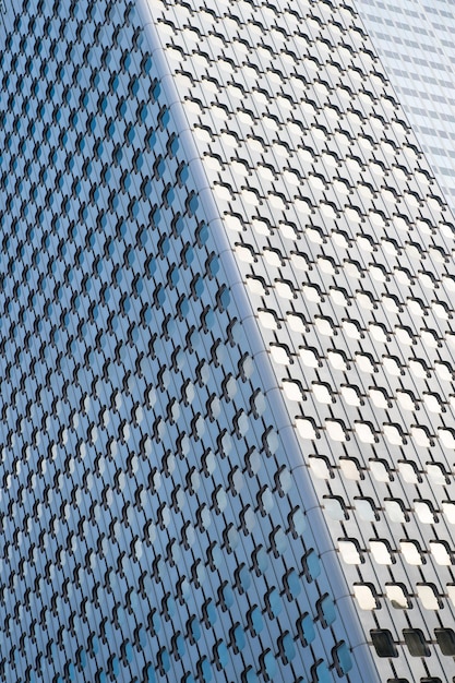 Panoramic and perspective wide angle view to steel blue background of glass high rise building