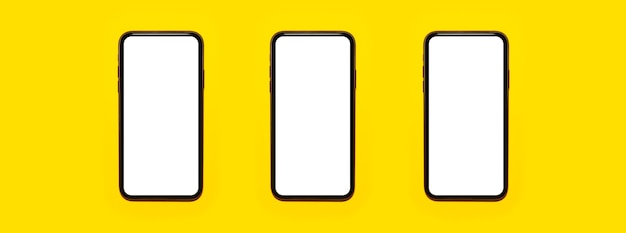 Панорамное фото трех смартфонов, изолированных на желтом