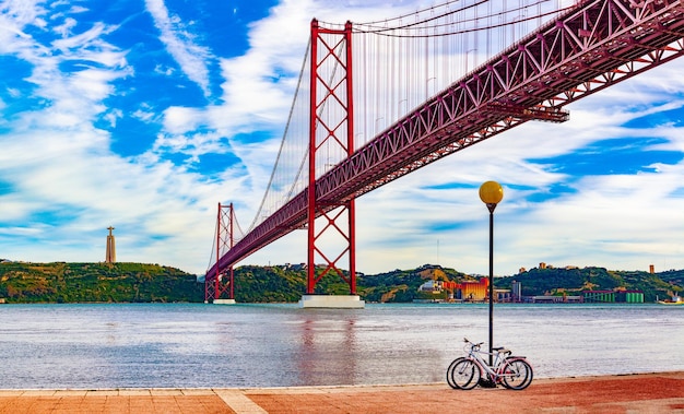 Panoramic photograph of the 25 de Abril bridge in the city of Lisbon over the Tajo River.