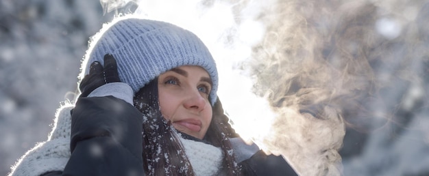 Panoramic Portrait of a woman outdoor in snowy weather with copy space