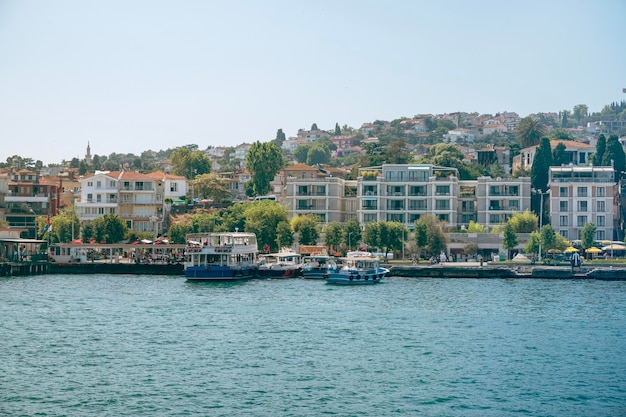 Panoramic sea view of the resort town with houses in the mountains and a pier with boats on a Adalar Islands