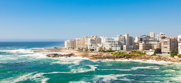 Panoramic shot of buildings surrounded by the sea in Cape Town, South Africa