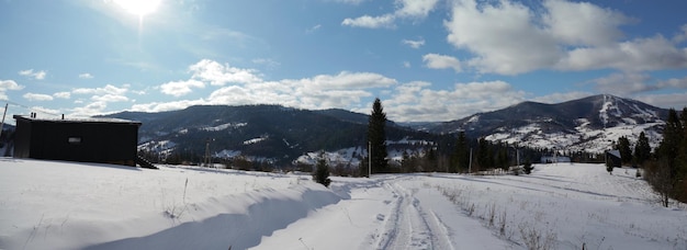 Panoramic shot of a modern wooden cabin on Carpathian mountains