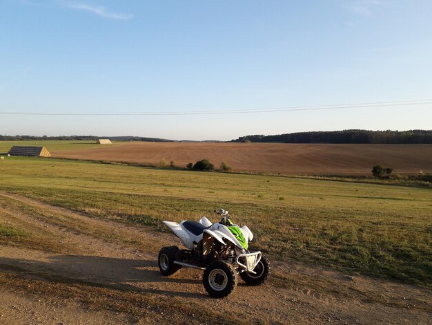 Panoramic shot of a quad bike in the field