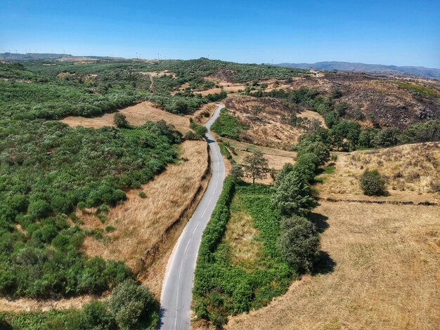 Photo panoramic shot of road amidst field against sky