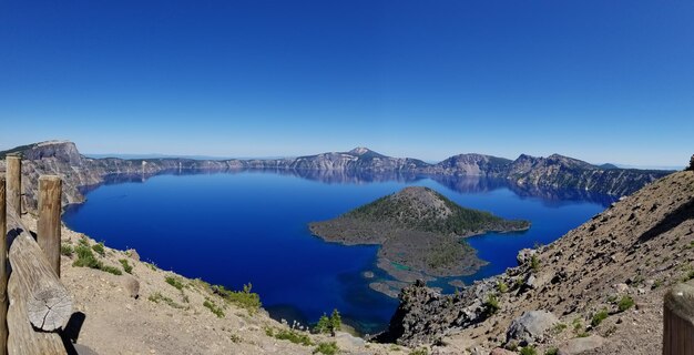 Panoramic shot of sea against clear blue sky