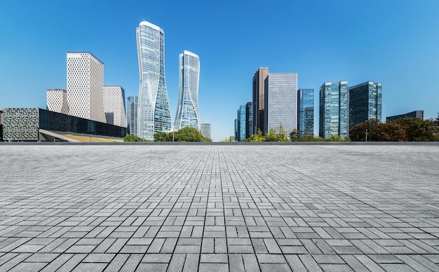 Panoramic skyline and buildings with empty concrete square floor