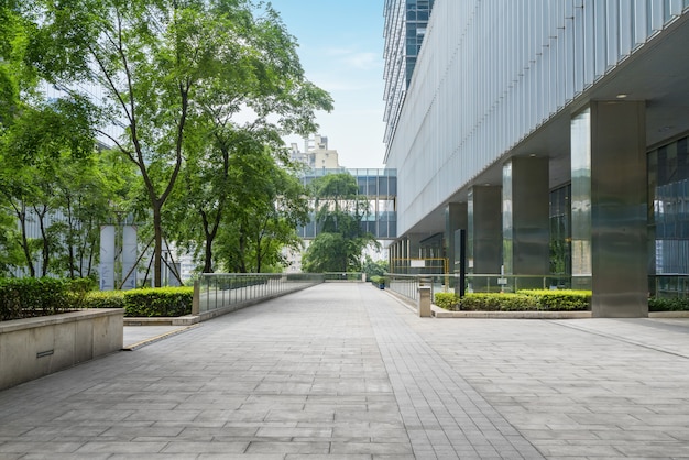 Panoramic skyline and buildings with empty concrete square floor