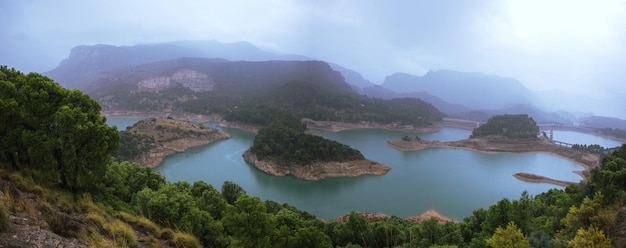 Panoramic of a storm in a mountain dam Ardales Malaga Spain
