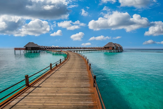 Panoramic travel landscape of Maldives beach Exotic luxury water villa resort wooden pier