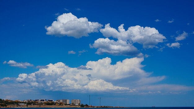 Panoramic view of buildings against blue sky