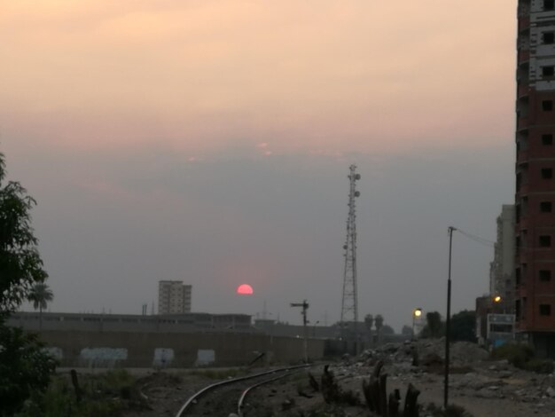 Panoramic view of city against sky at sunset