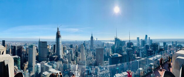 Panoramic view of city buildings against sky