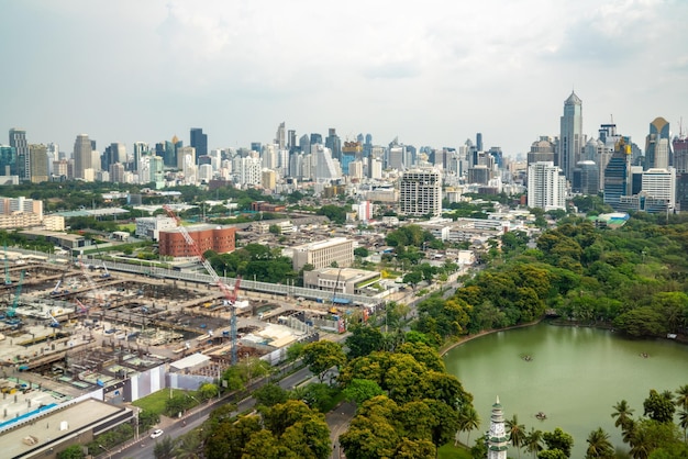 Panoramic view of cityscape and construction site in metropolis