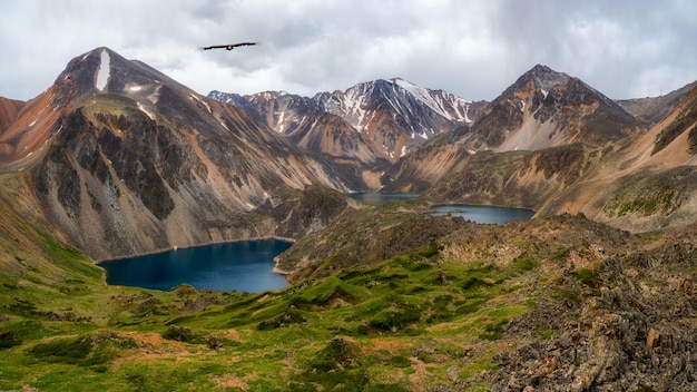 Panoramic view of a clean mountain lake in the Altai. Beautiful turquoise lake. Unusual transparent lake in autumn time.