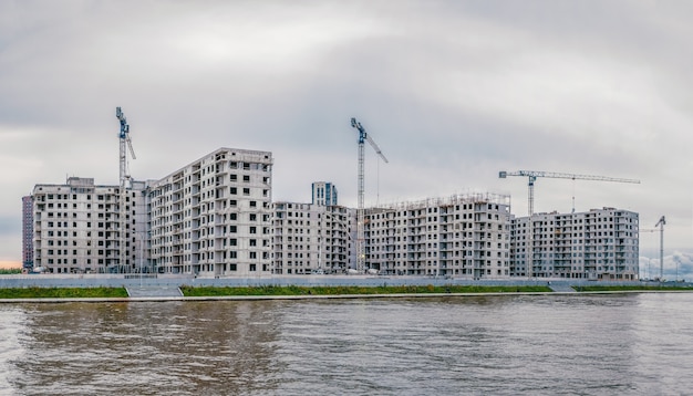 Panoramic view of construction work site and high rise building