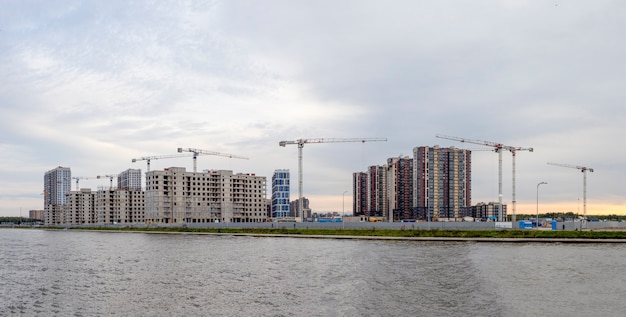 Panoramic view of construction work site and high rise building