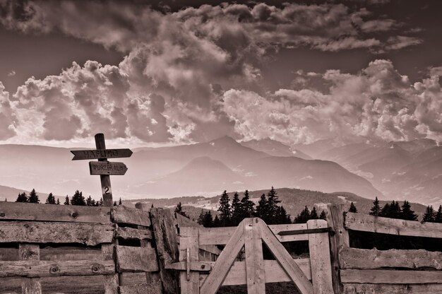 Panoramic view of cross on mountain against sky