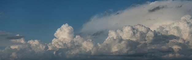 Panoramic view of cumulus clouds summer sky