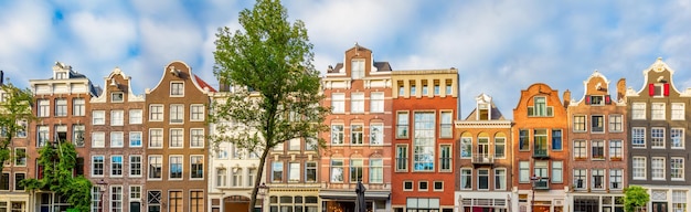 Panoramic view of famous Amsterdam houses and rooftops No logos and inscriptions Amsterdam Holland Netherlands Europe