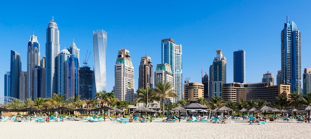 Panoramic view of famous skyscrapers and jumeirah beach in Dubai. UAE