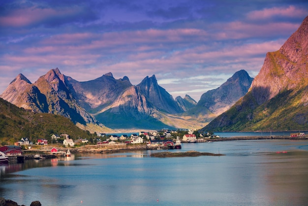 Panoramic view of the fishing village of Reine with dramatic sky Rocky beach Lofoten islands Norway