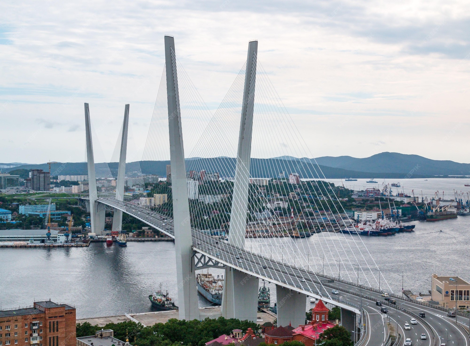 Premium Photo | Panoramic view from eagle's hill on the zolotoy golden bridge is cable-stayed bridge across the zolotoy rog or golden horn in vladivostok, russia