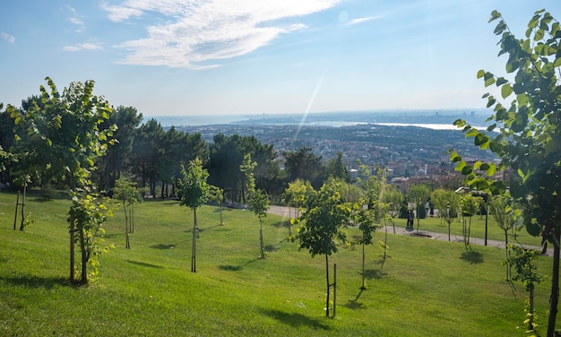 Panoramic view from the mountain with garden to the city on a summer day in a sunny haze Istanbul Turkey