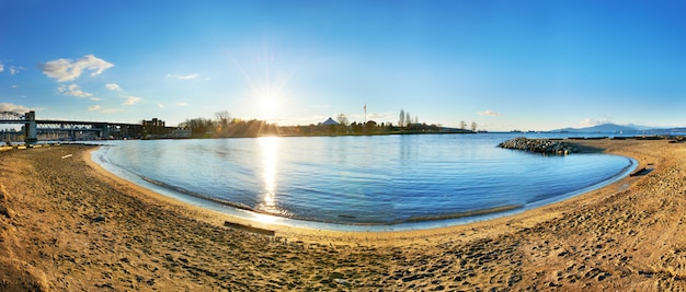 Panoramic view from the sandy beach side. 