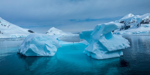 Panoramic view of frozen lake against sky