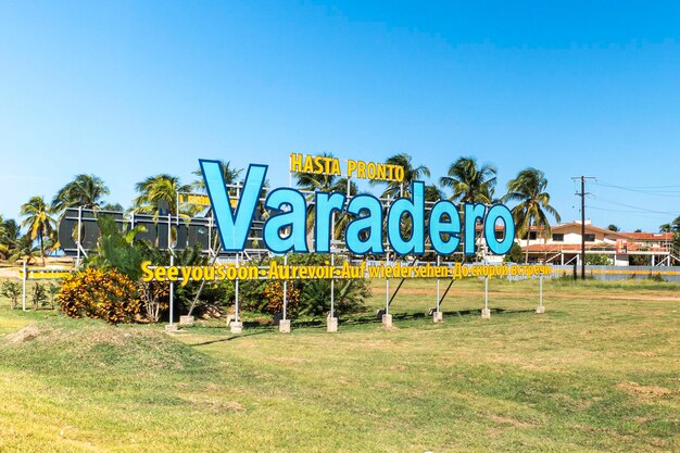 Panoramic view of grand blue and yellow inscription Varadero at the entrance to the city at summer sunny day