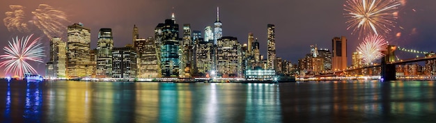 panoramic view of illuminated cityscape and river at night