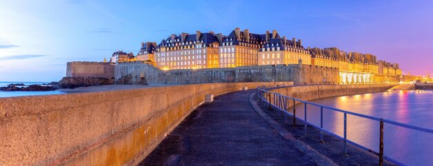 Panoramic view of medieval walled city and fortress saintmalo at sunset brittany france