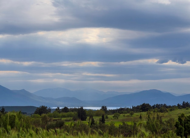 Panoramic view of mountain field and sky with clouds on on the island of Evia Greece