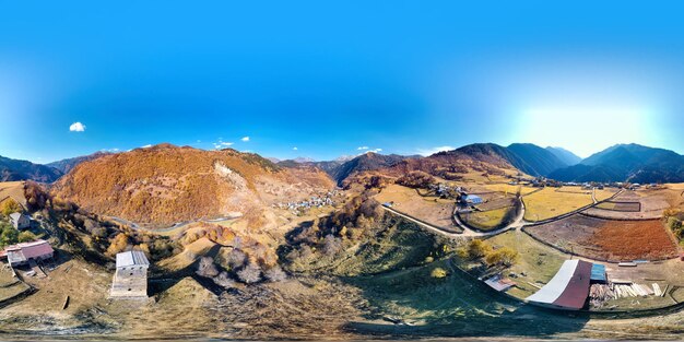 Panoramic view of mountain range against blue sky