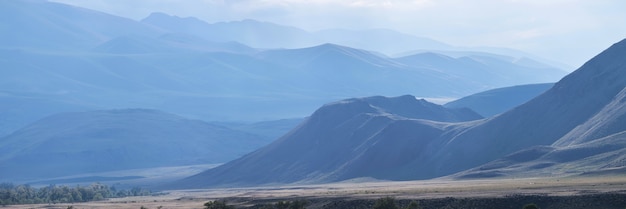 Panoramic view of the mountains in the morning haze	