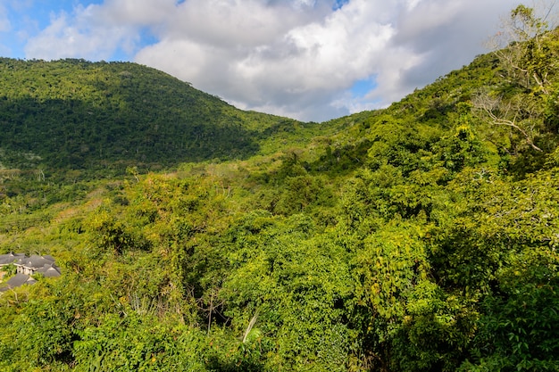 Panoramic view to mountains, tropical forest, Yanoda Park and Sanya city. Rainforest cultural tourism zone Yanoda, Hainan island, Yalong Bay Tropical Paradise Forest Park. China.