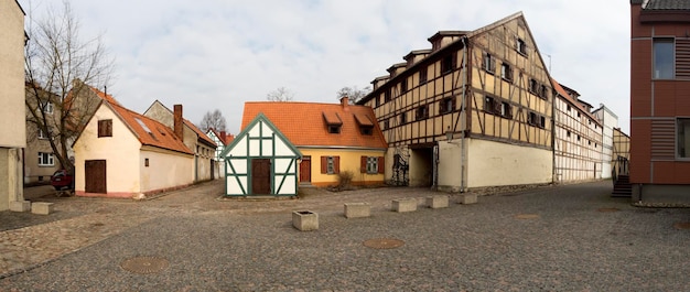 Panoramic view Old houses in the paved street of the Old Town of Klaipeda Lithuania