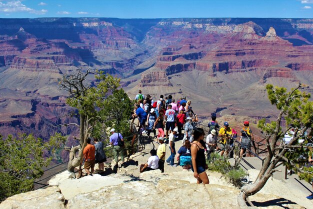 Panoramic view of people on rocky mountains