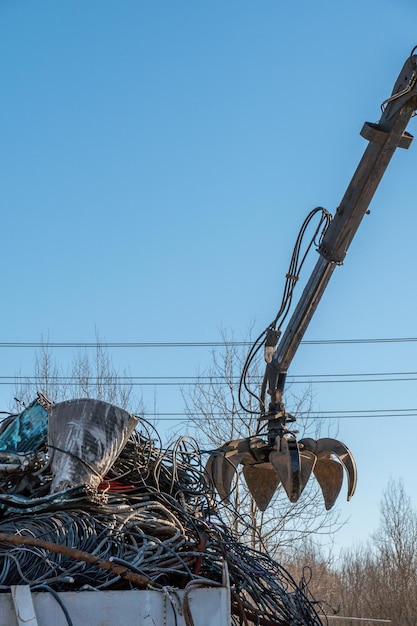 Panoramic view of a pile of rusty scrap metal at a landfill for recycling