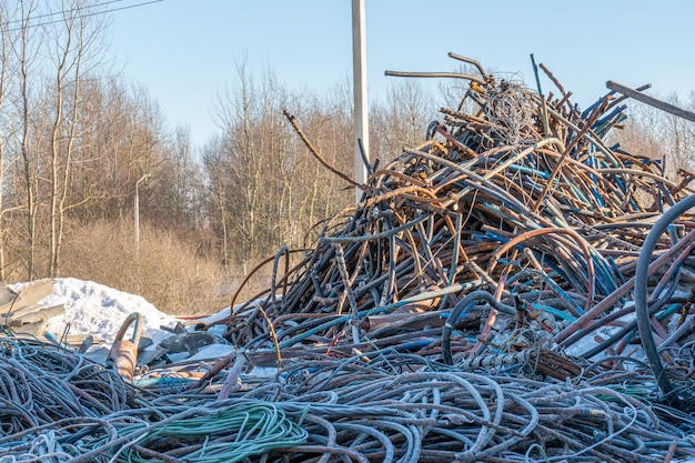 Panoramic view of a pile of rusty scrap metal at a landfill for recycling