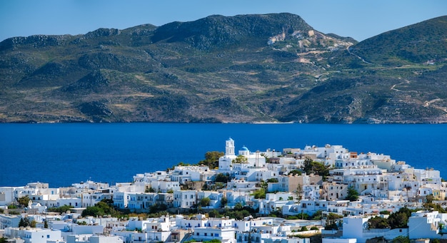 Panoramic view of Plaka village with traditional Greek church Milos island Greece