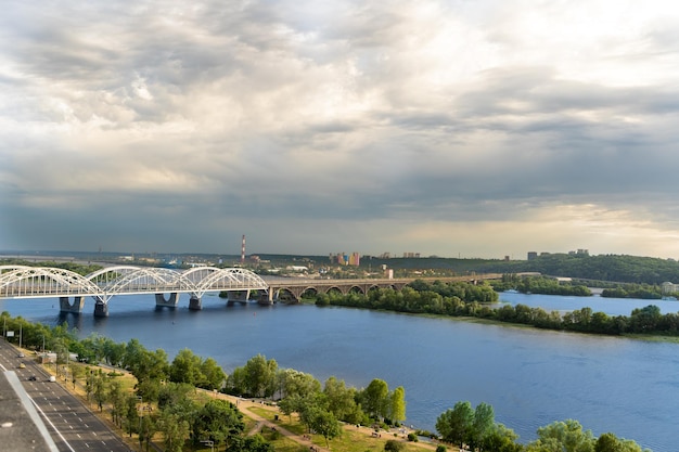 Panoramic view of the right bank of Kiev Dnieper river evening and sunset Metro bridge Sight Nice view from the balcony