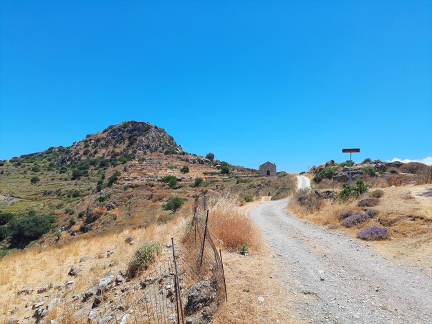 Panoramic view of road against clear blue sky