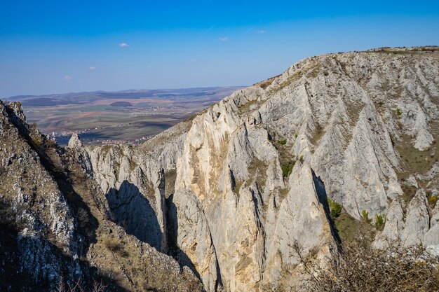 Panoramic view of rocky mountains against sky