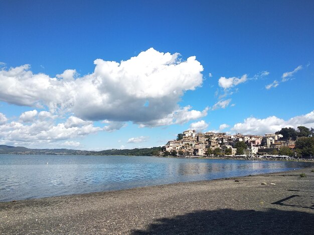 Panoramic view of sea and buildings against sky