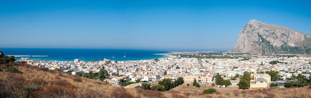 Panoramic view of sea and buildings against sky