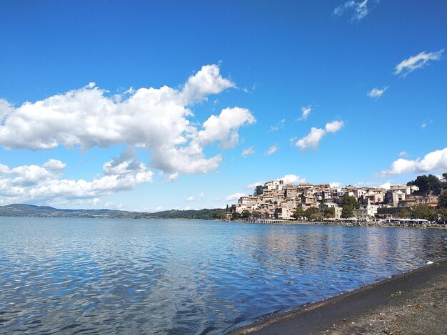 Panoramic view of sea and buildings against sky