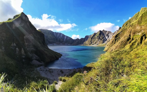 Panoramic view of sea and mountains against sky