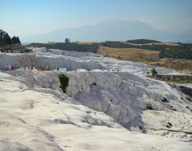 Panoramic view of the snowwhite travertines of Pamukkale and the mountains Turkey